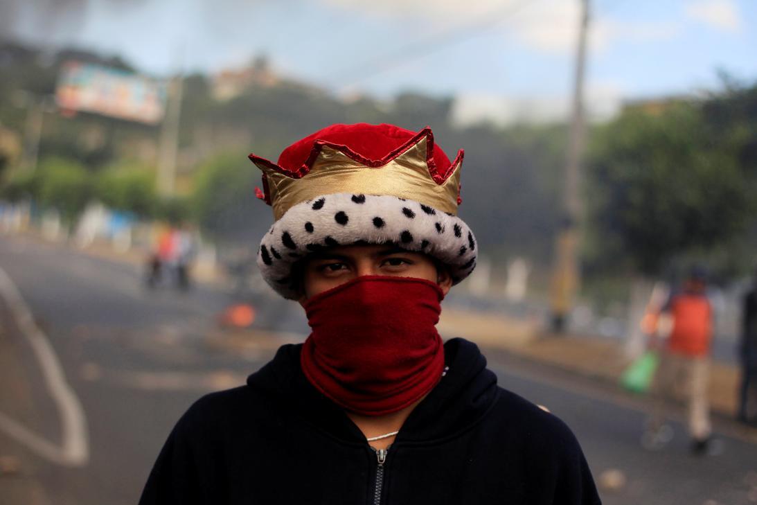In photos: Police clash with the opposition protesters over disputed ele...