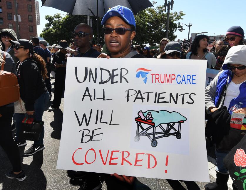 Protesters march towards the Federal Building during a "Save the Af...